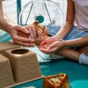 Two children inside of the hamster playpen with various accessories