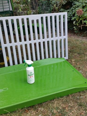 An Omlet dropping tray and roosting bars with spray cleaner.